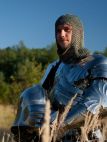 Front view of medieval knight gothic armor set with helmet