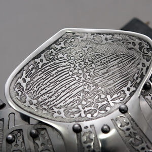 Close view of etched ArmStreet's arm cop