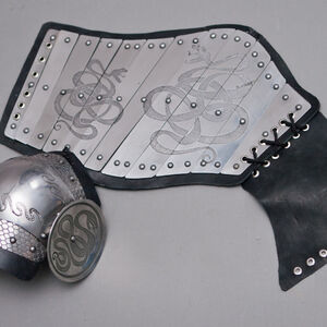 Fantasy armor legs splinted plate decorated with etching