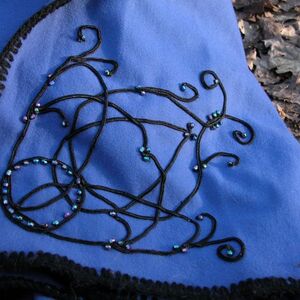 Handmade embroidery on medieval cloak