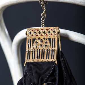 “Renaissance Memories” suede bag with a brass frame